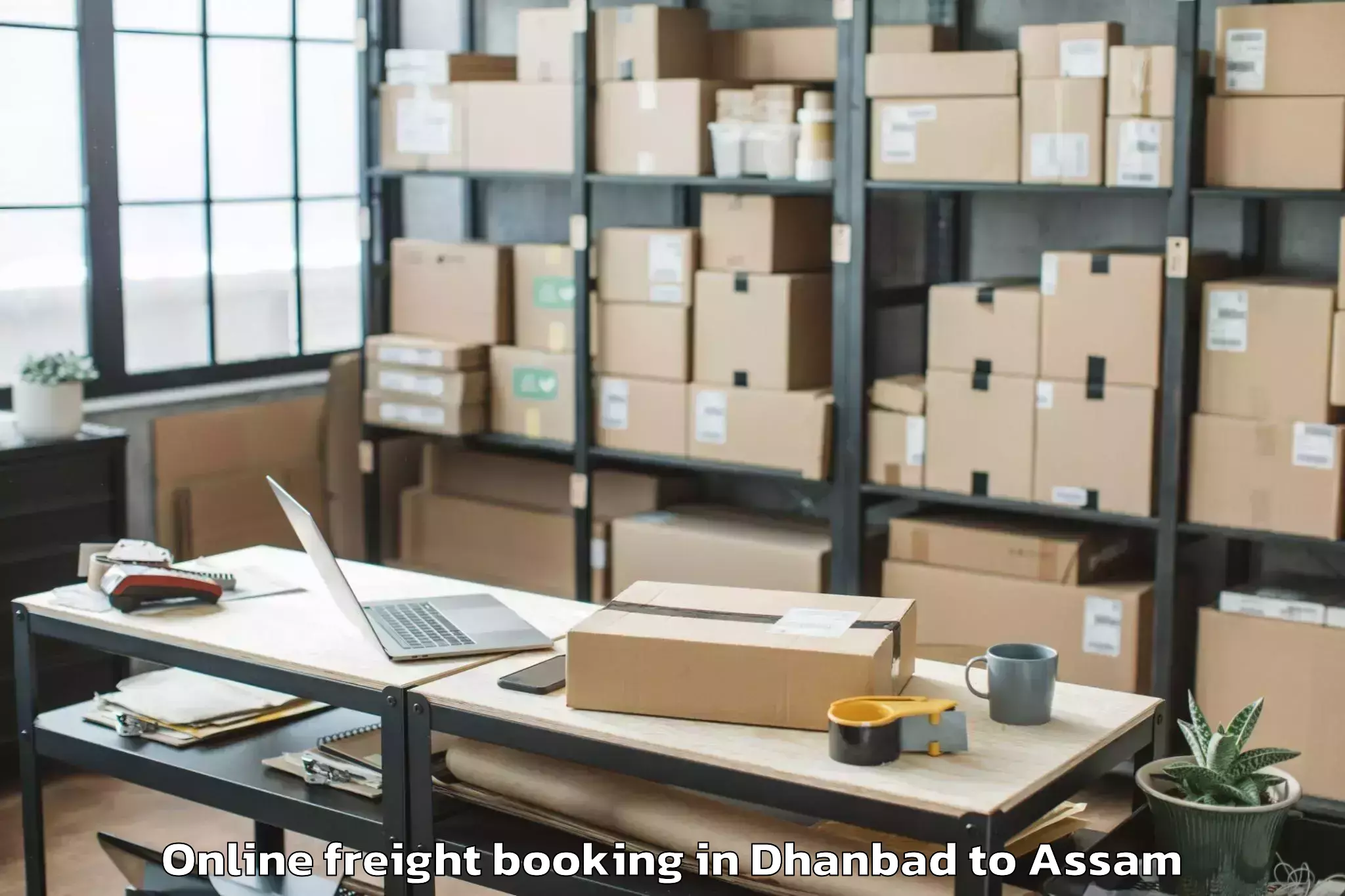 Book Dhanbad to Goshaingaon Online Freight Booking Online